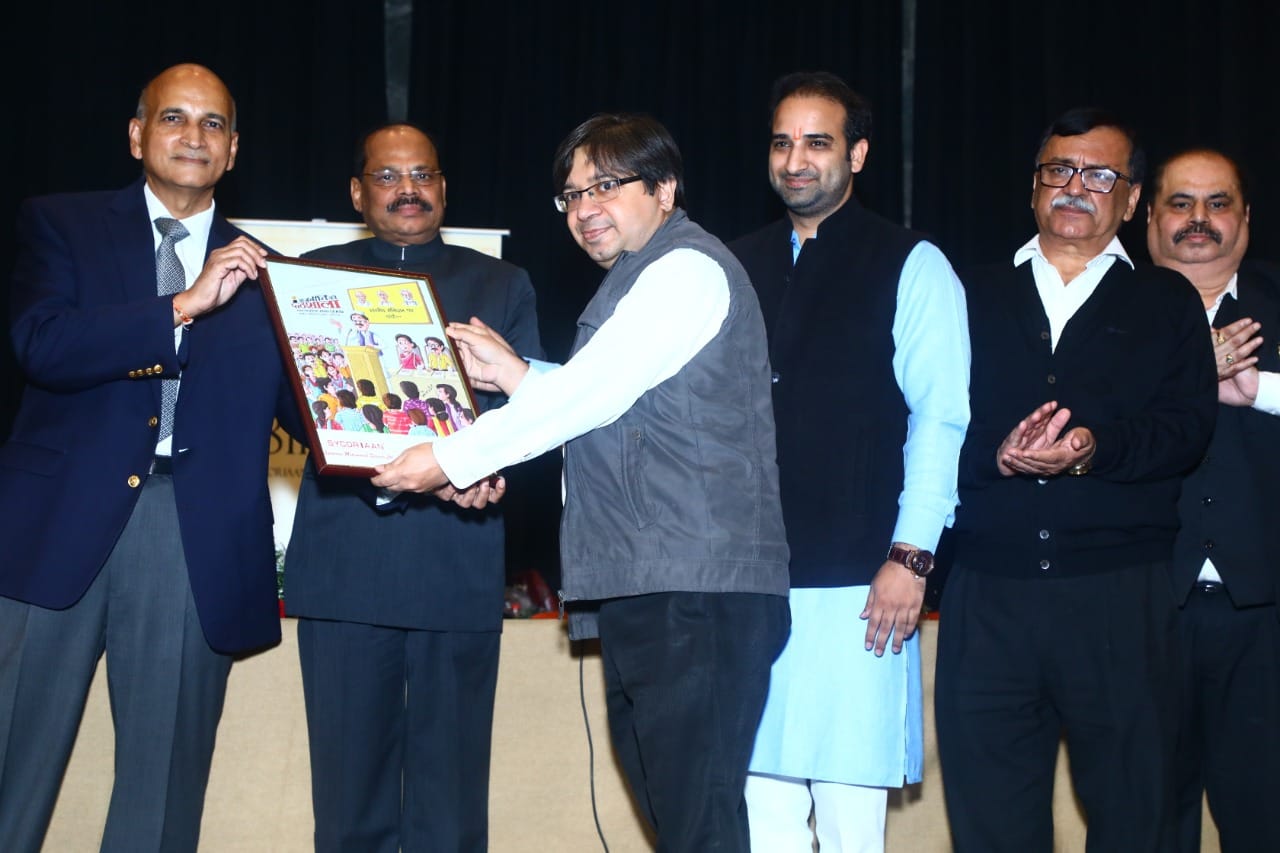 Kapil Chawla being felicitated at a community gathering